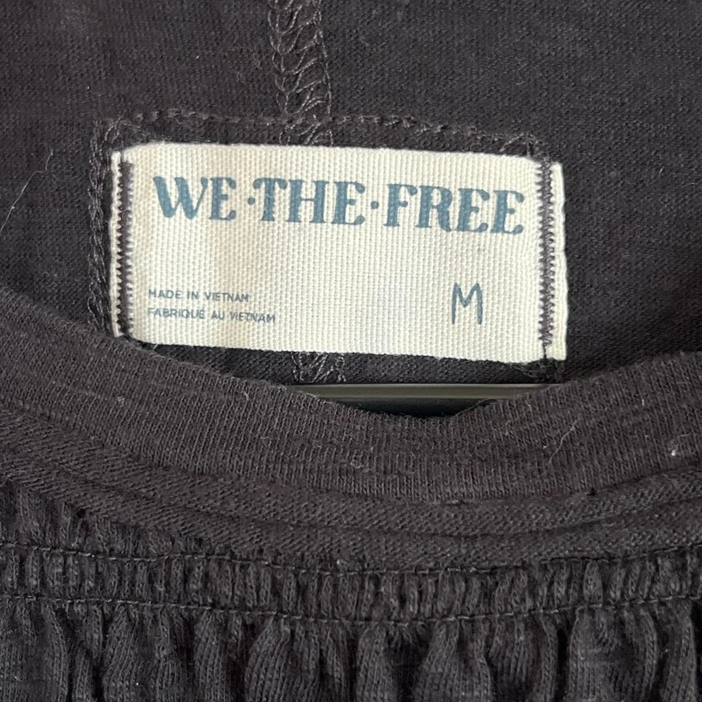 Free People Black Smocked Ruffle Hem Long Sleeve Top